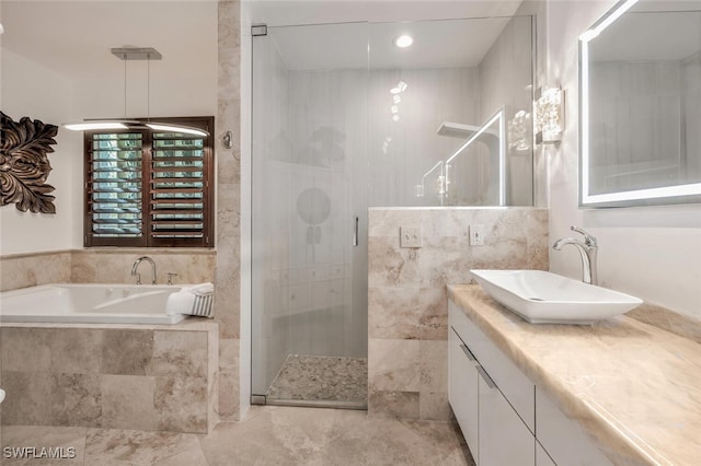 bathroom featuring vanity and plus walk in shower