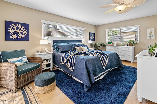 bedroom featuring light wood-type flooring and ceiling fan