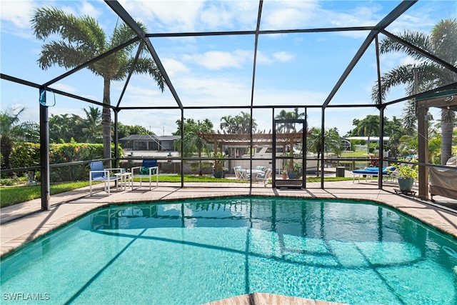 view of pool with a lanai and a patio area