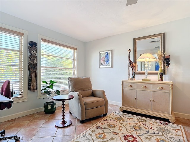 sitting room featuring a wealth of natural light and light tile patterned floors