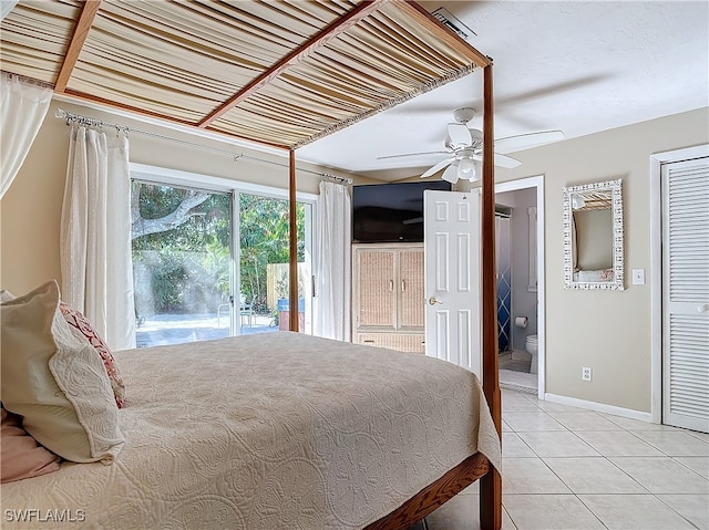 tiled bedroom with connected bathroom, access to outside, and ceiling fan