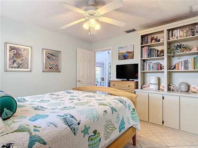 tiled bedroom with ceiling fan