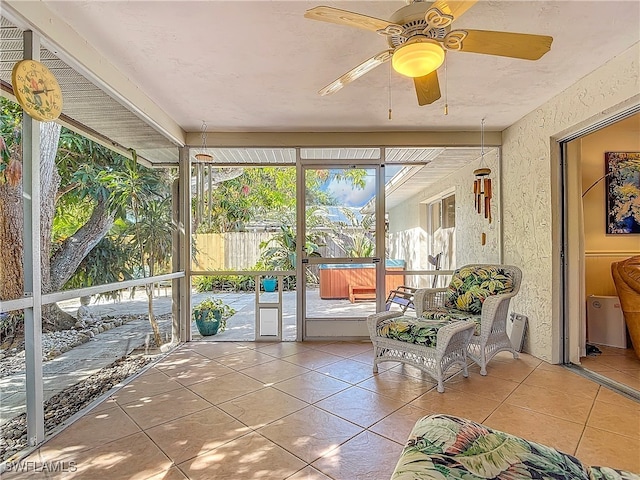 sunroom with ceiling fan