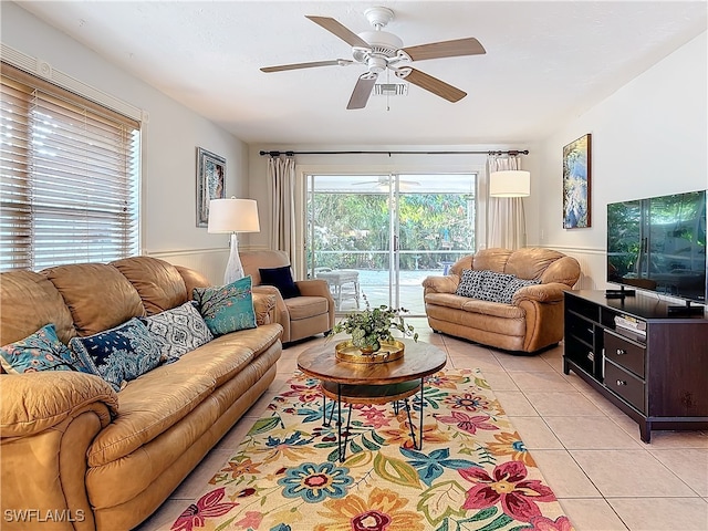 living room featuring ceiling fan and light tile patterned flooring