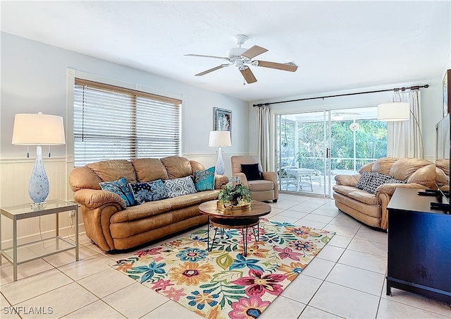 living room featuring ceiling fan and light tile patterned floors