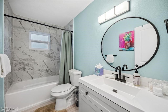 full bath with toilet, shower / bath combo with shower curtain, and vanity