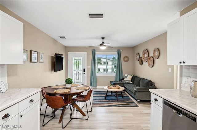 dining room featuring ceiling fan and light hardwood / wood-style flooring