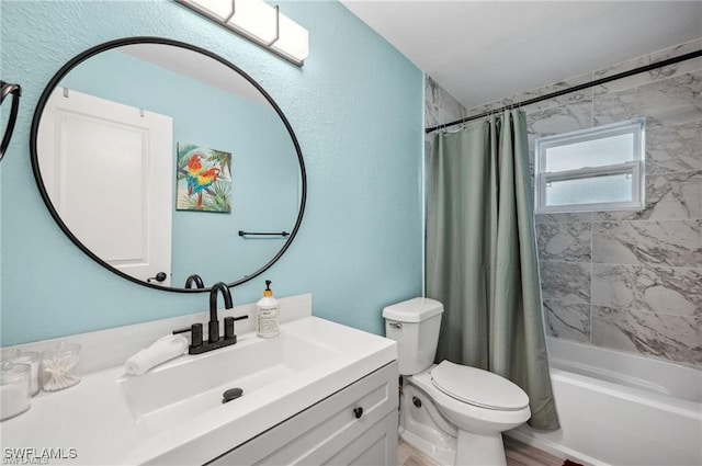 full bathroom featuring shower / bath combo, vanity, and toilet