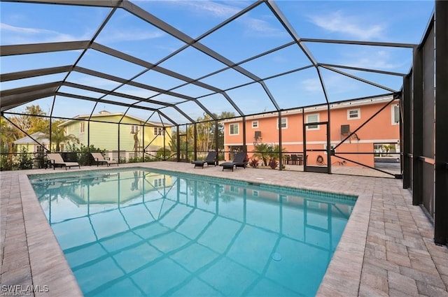 view of pool featuring a lanai and a patio area