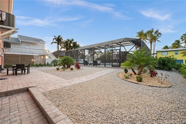 113/115 Bahia Viaduct, Fort Myers Beach, FL 33931 - view of yard featuring a patio area and a lanai