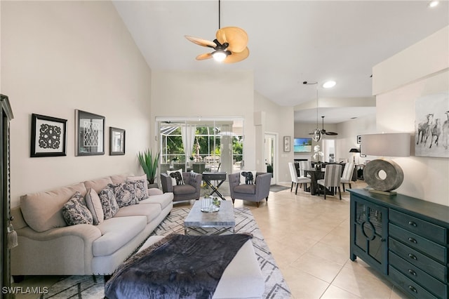 living room with light tile patterned floors, high vaulted ceiling, and ceiling fan