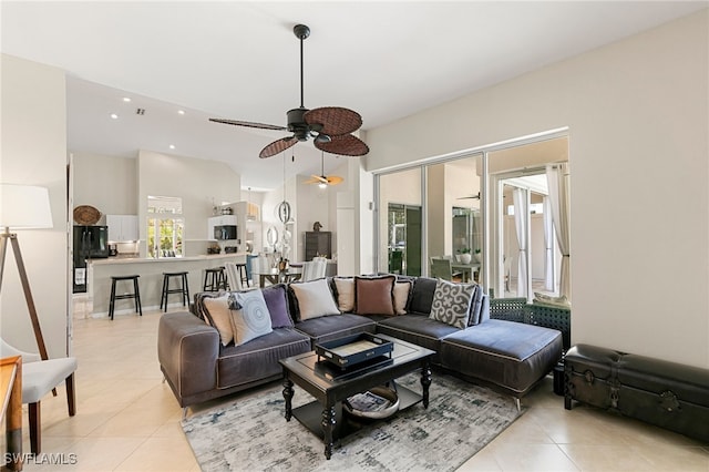 living room featuring ceiling fan and light tile patterned floors