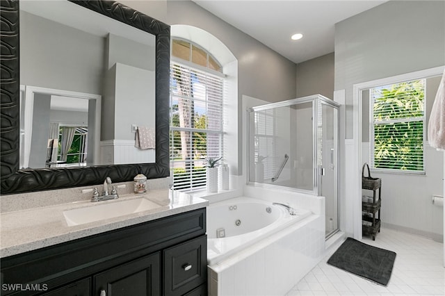 bathroom featuring tile patterned floors, vanity, and plus walk in shower