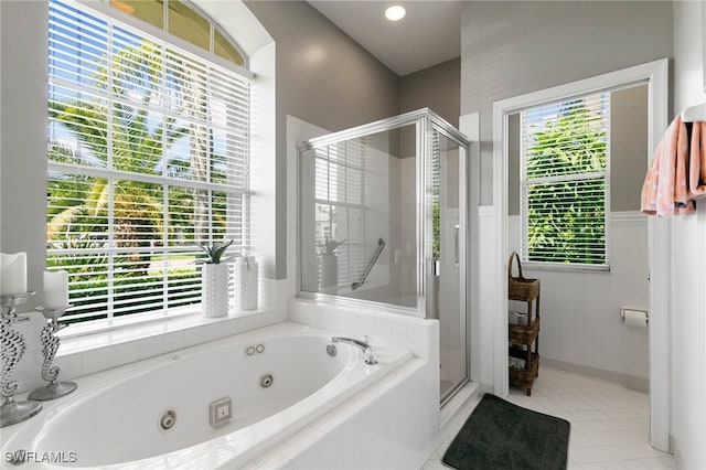 bathroom with separate shower and tub, tile patterned floors, and plenty of natural light