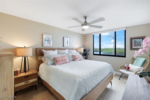 bedroom featuring ceiling fan and light hardwood / wood-style flooring