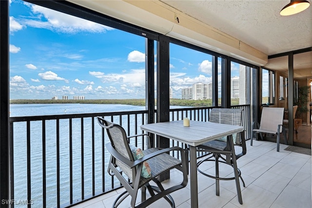 sunroom with a water view