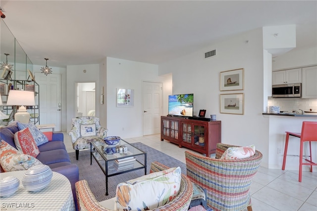 living room with light tile patterned floors