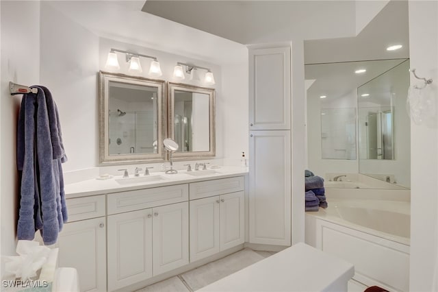 bathroom featuring vanity, tile patterned flooring, and plus walk in shower