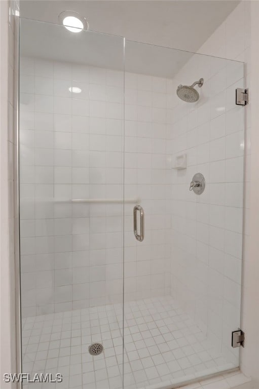 bathroom with a shower with shower door