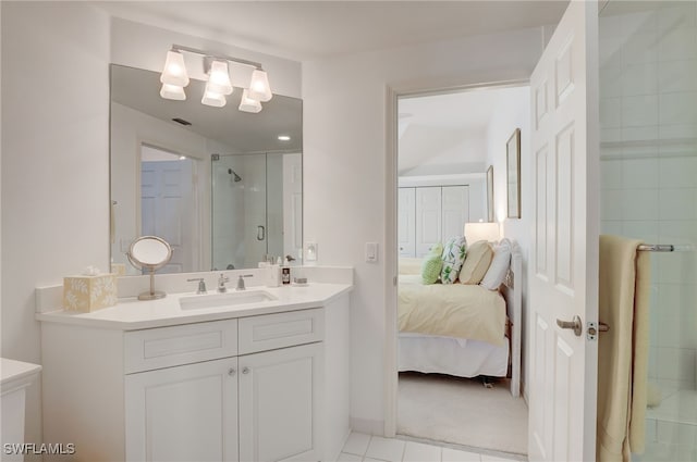 bathroom featuring tile patterned floors, vanity, and walk in shower