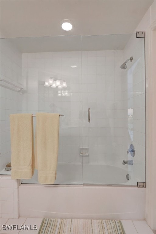 bathroom with tile patterned flooring and enclosed tub / shower combo