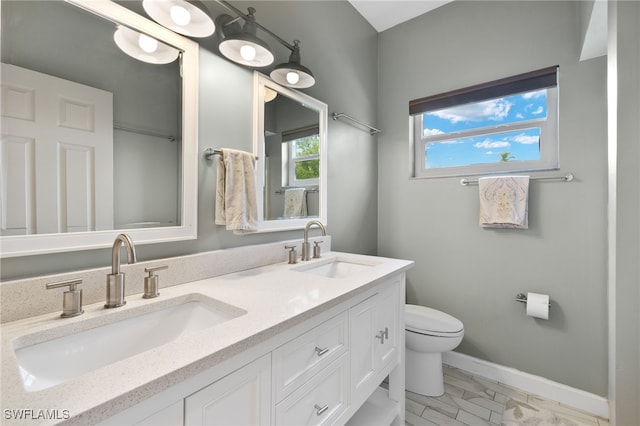 bathroom with vanity and toilet