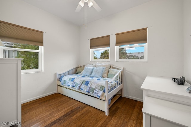 bedroom featuring ceiling fan and dark hardwood / wood-style flooring