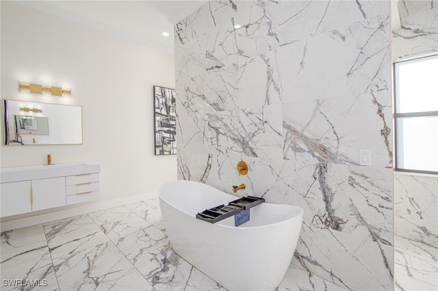 bathroom featuring vanity, crown molding, a bath, and tile walls