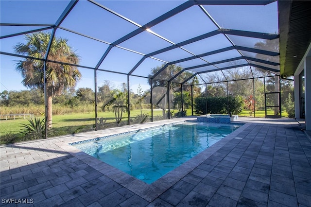 view of pool featuring a lanai, a patio, and an in ground hot tub