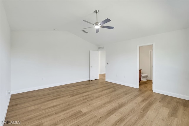 unfurnished bedroom with ensuite bathroom, ceiling fan, light wood-type flooring, and lofted ceiling