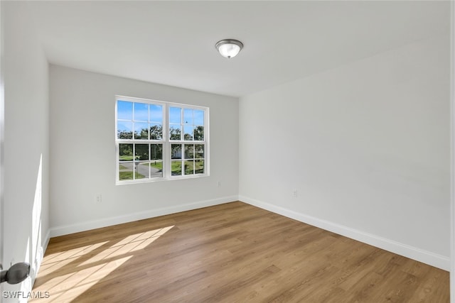 spare room featuring light hardwood / wood-style floors