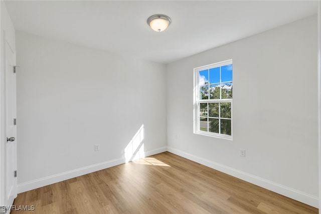 spare room featuring light hardwood / wood-style floors