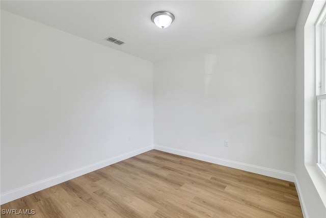 empty room with light wood-type flooring