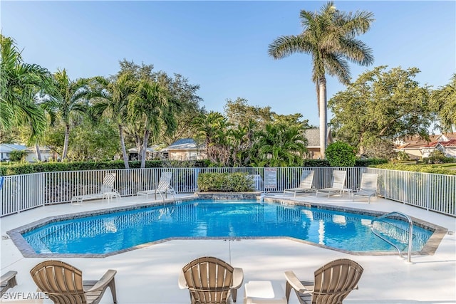 view of swimming pool featuring a patio