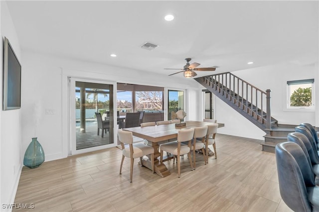 dining area featuring ceiling fan and light wood-type flooring