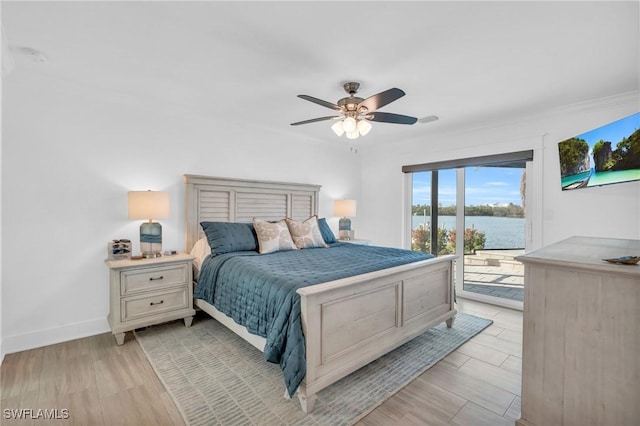 bedroom featuring ceiling fan, light hardwood / wood-style floors, and access to outside