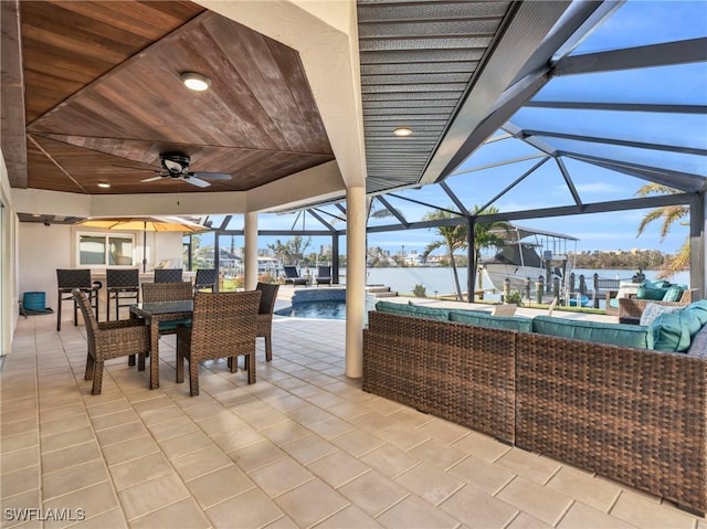 view of patio / terrace with a lanai, ceiling fan, and an outdoor hangout area