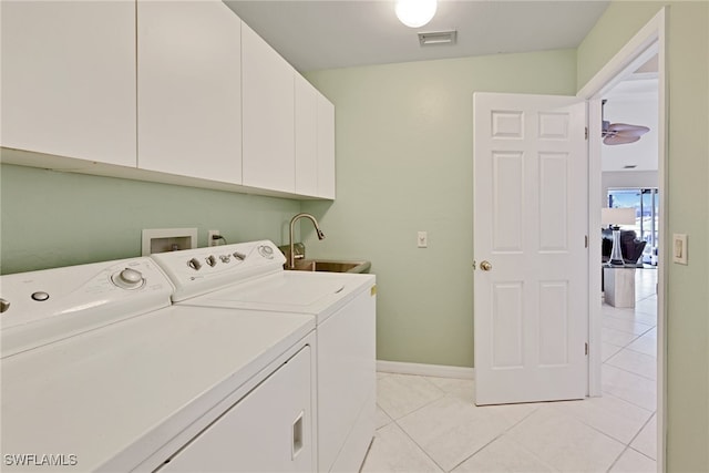 laundry area with ceiling fan, sink, cabinets, washer and clothes dryer, and light tile patterned flooring