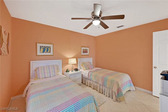 tiled bedroom with ceiling fan