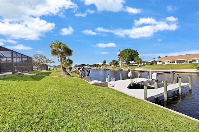 view of dock featuring a water view, glass enclosure, and a lawn