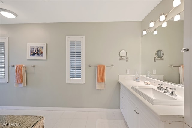 bathroom with tile patterned floors and vanity