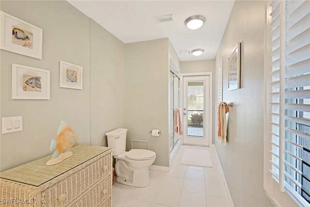 bathroom with tile patterned flooring and toilet