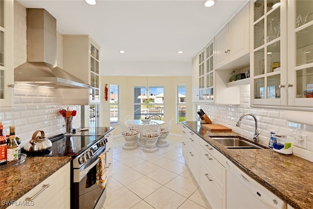 kitchen with decorative backsplash, white dishwasher, sink, wall chimney range hood, and stainless steel electric range