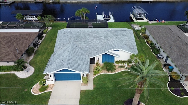 birds eye view of property with a water view