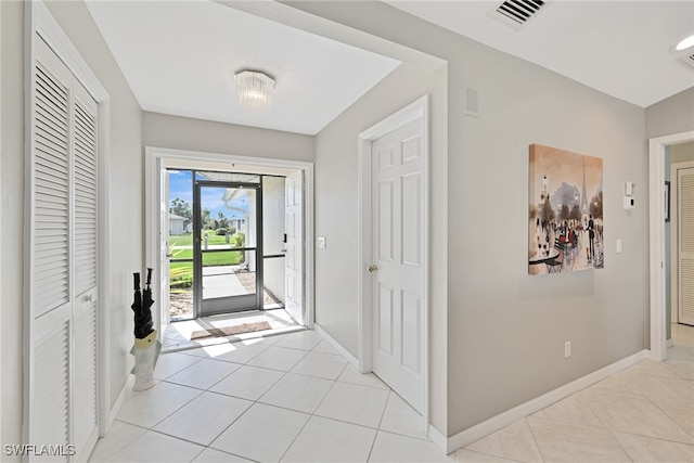 entrance foyer with light tile patterned floors