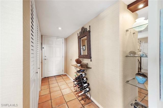 hallway featuring light tile patterned flooring