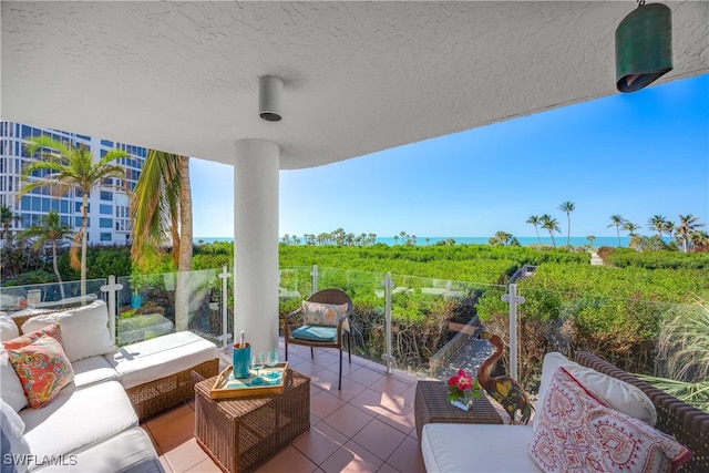 view of patio featuring outdoor lounge area and a balcony