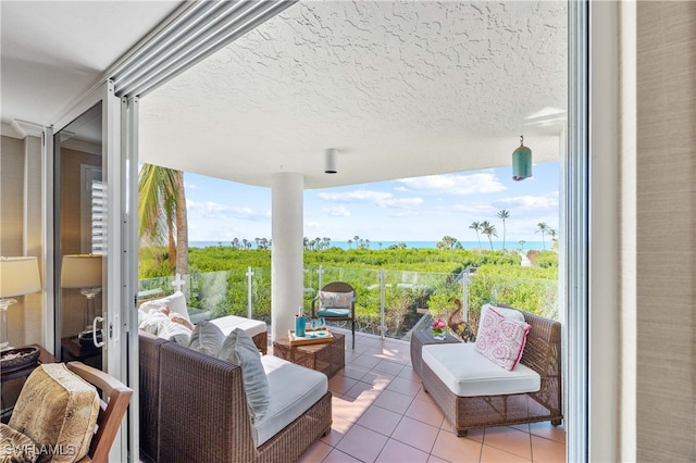 view of patio / terrace featuring an outdoor living space and a water view