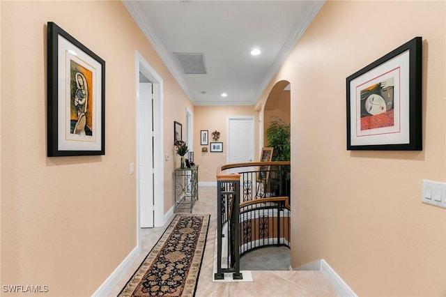 hall featuring an upstairs landing, recessed lighting, arched walkways, crown molding, and baseboards