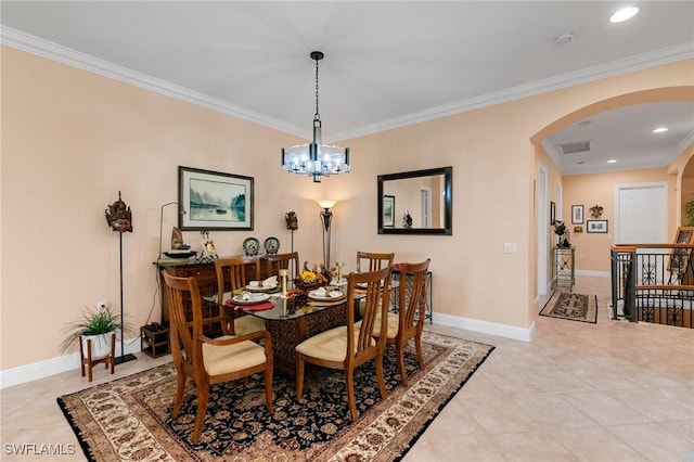 dining area featuring crown molding, light tile patterned flooring, baseboards, and arched walkways